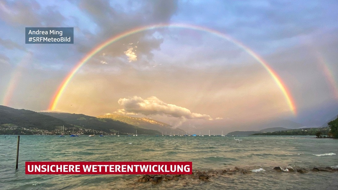 Regenbogen über See