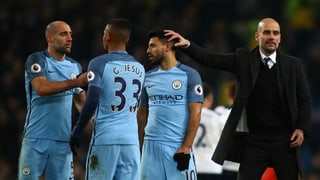 Manchester-City-Trainer Pep Guardiola und drei seiner Spieler.