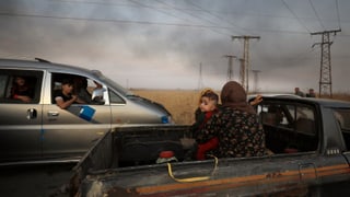 Flüchtlinge auf Pick-up-Trucks (9. Oktober)