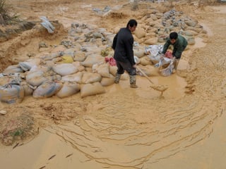 Arbeiter in einer Mine in der Jiangxi-Provinz im Südosten von China. Arbeiter in einer Mine in der Jiangxi-Provinz im Südosten von China.