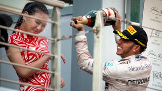 Lewis Hamilton spritzt einer chinesischen Ehrendame Champagner ins Gesicht. 