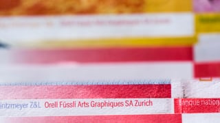 Nahaufnahme von Geldnoten, Orell Füssli Arts Graphiques SA Zurich ist darauf zu lesen.