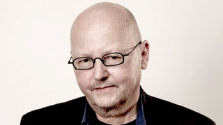 Der Autor Claude Cueni mit Brille.