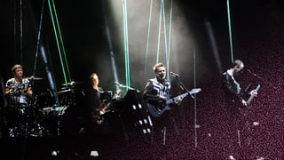 Die Band Muse auf der Bühne.