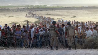 Kurdische Flüchtlinge an der syrischen Grenze