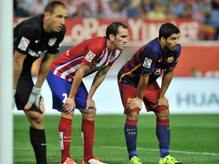 Diego Godin und Luis Suarez während eines Spiels