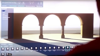 Ein mann erstellt ein 3D-Gebäude am Computer.