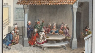 Menschen in eleganter Kleidung und fröhlicher Stimmung sitzen an einem runden Tisch.