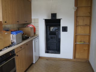 Küche in Arbeiterwohnung, ausgeräumt aber noch nicht fertig zurückgebaut