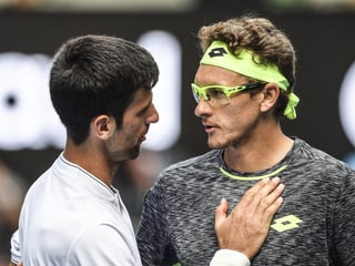 Novak Djokovic gratuliert Denis Istomin zum Sieg