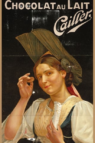 Frau in traditioneller Kleidung hält Schokolade.