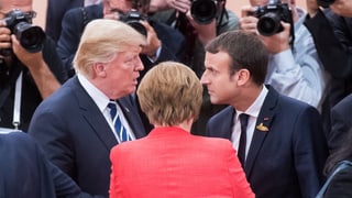 Donald Trump, Angela Merkel und Emmanuel Macron.