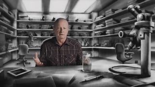 Ein Mann sitzt vor einem gezeichneten Labor in dem viele Geräte stehen und erklärt etwas.