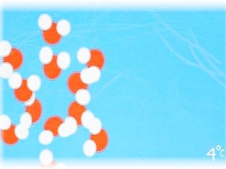 Schema: Wassermoleküle, rote Kreisflächen mit zwei weisen kreisflächen liegen ungeordent dicht beieinander
