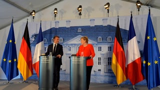 Emmanuel Macron (linke Seite) und Angela Merkel