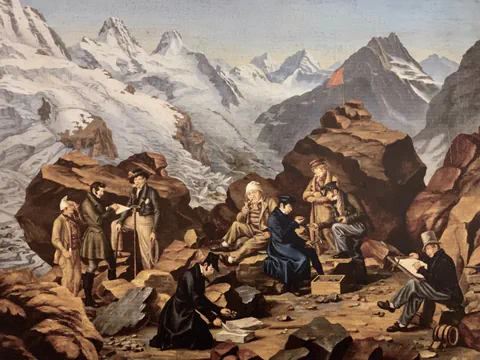Gruppe von Wissenschaftlern, die auf Felsen in den Alpen arbeiten.