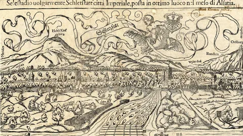 Historische Karte von Schlettstadt mit Bergen und dekorativen Elementen.