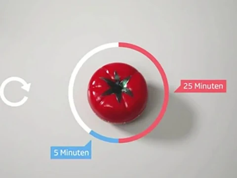 Rote Tomatenküchenuhr mit Zeitanzeige.