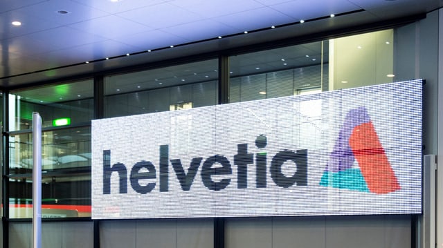 Logo der Helvetia in einem Konferenzraum Logo der Helvetia in einem Konferenzraum