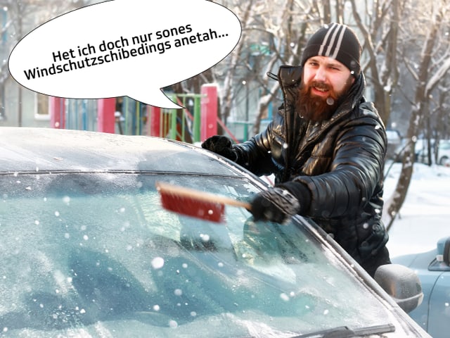 Man putzt vereiste Windschutzscheibe. Man putzt vereiste Windschutzscheibe.