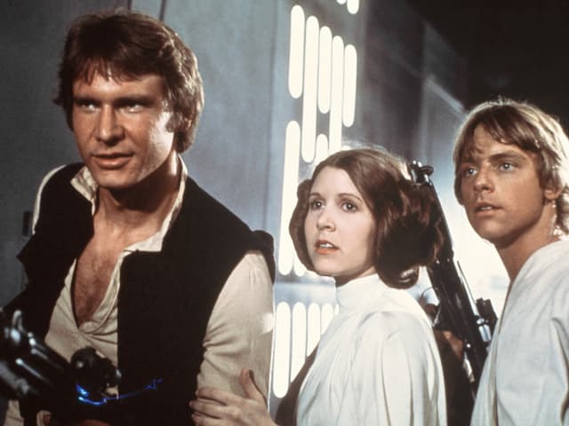 Harrison Ford sco Han Solo, Carrie Fisher sco princessa Leia e Marc Hamill sco Luke Skywalker. Harrison Ford sco Han Solo, Carrie Fisher sco princessa Leia e Marc Hamill sco Luke Skywalker.
