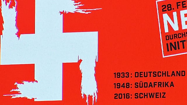 Ausschnitt aus dem Plakat: Ausgefranstes weisses Hakenkreuz auf rotem Grund Ausschnitt aus dem Plakat: Ausgefranstes weisses Hakenkreuz auf rotem Grund