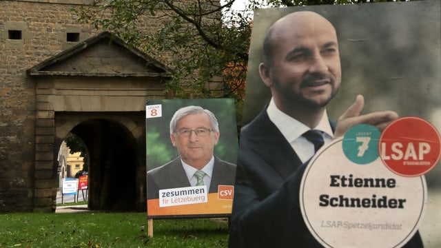 Jean-Claude Juncker und Etienne Schneider auf Wahlplakaten. Jean-Claude Juncker und Etienne Schneider auf Wahlplakaten.