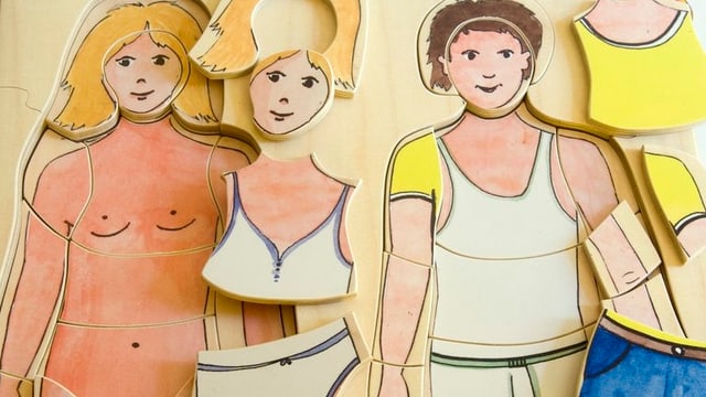 Ein Puzzle für kleine Kinder, mit dem sie die Körper von Mann und Frau unterscheiden lernen. Ein Puzzle für kleine Kinder, mit dem sie die Körper von Mann und Frau unterscheiden lernen.