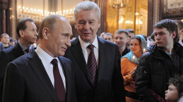 Putin und Sobjanin in der Kirche Putin und Sobjanin in der Kirche