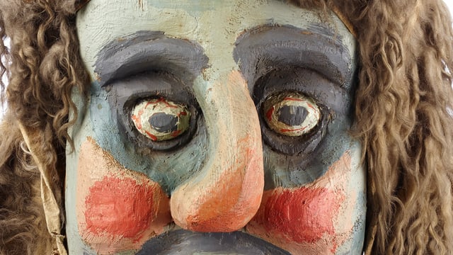 Ausschnitt einer Fotografie einer Maske. Ausschnitt einer Fotografie einer Maske.