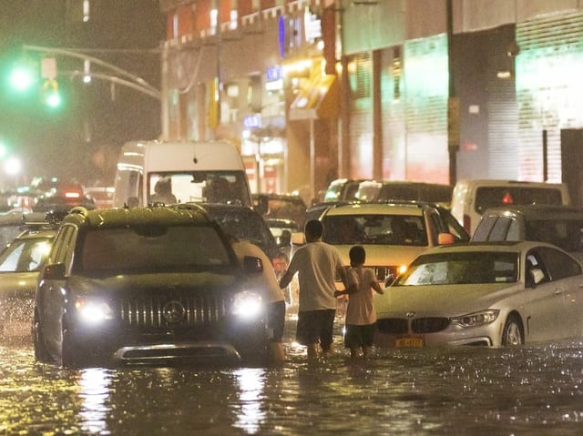 Hardly getting through: Cars are stuck on a street in the New York borough of Queens.