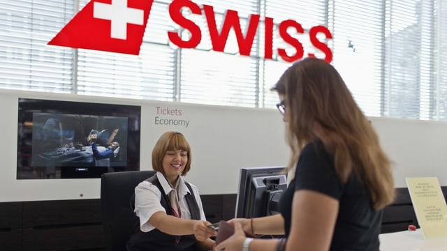 Swiss counter, a woman registers. Swiss counter, a woman registers.