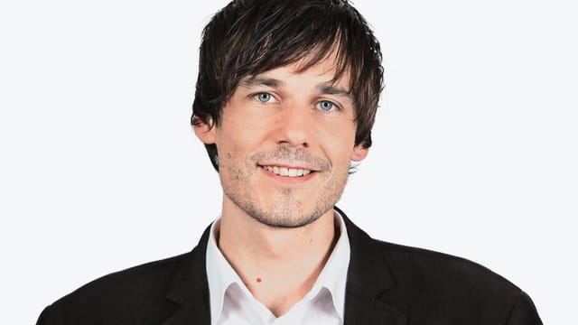Porträtfoto von Dominik Meier. Porträtfoto von Dominik Meier.