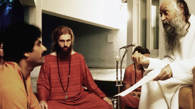 Video «Guru Bhagwan, his secretary & his bodyguard» abspielen Video «Guru Bhagwan, his secretary & his bodyguard» abspielen