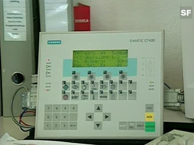 Ein weisses elektronisches Steuergerät mit grüner Digitalanzeige.