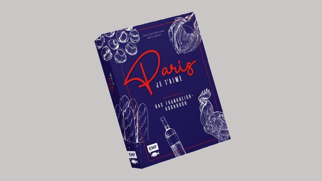 Blaues Buch mit roter Schrift: «Paris je t'aime». Blaues Buch mit roter Schrift: «Paris je t'aime».