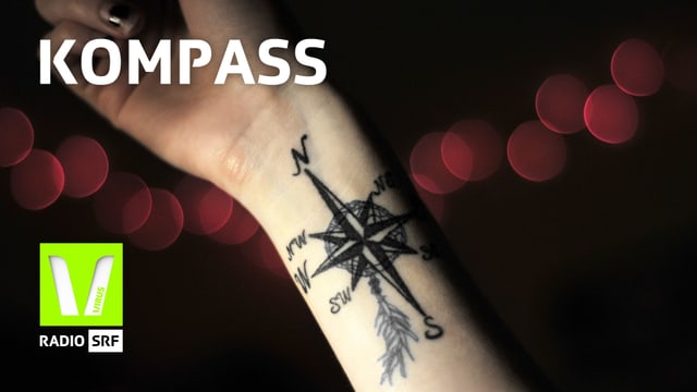 Hand mit Kompasstattoo Hand mit Kompasstattoo