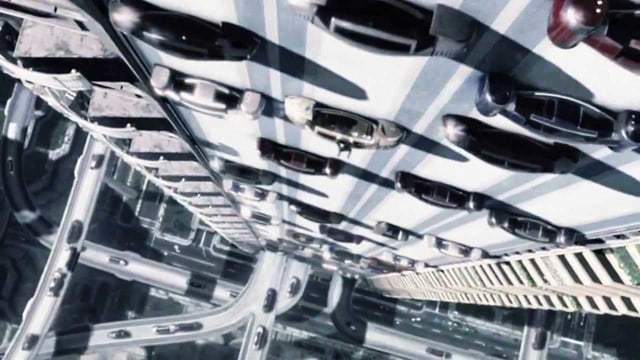 Autos gleiten senkrecht eine Wand hinunter unten ist eine Strassenkreuzung. Autos gleiten senkrecht eine Wand hinunter unten ist eine Strassenkreuzung.