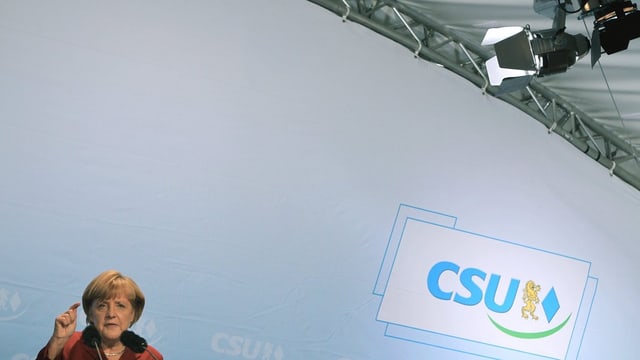 Angela Merkel an einem Rednerpult. Angela Merkel an einem Rednerpult.