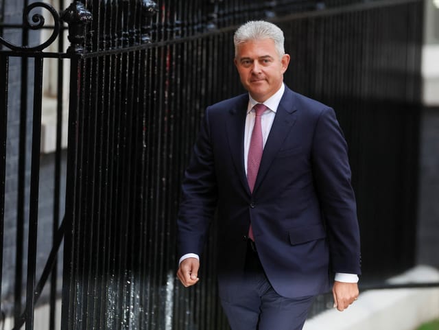 Brandon Luce walks down 10th Downing Street.