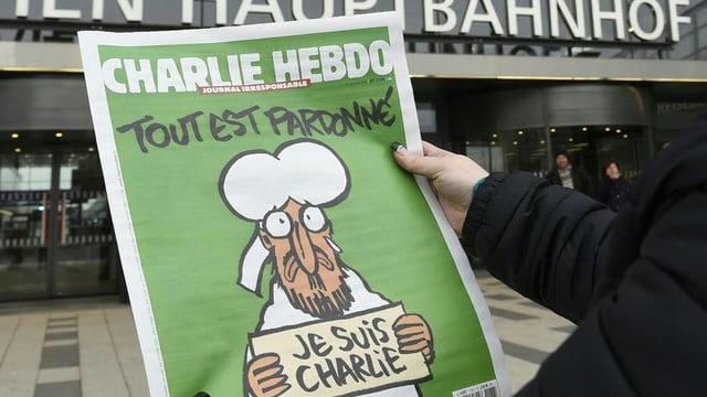 Il frontispizi da l'ultima ediziun da "Charlie Hebdo": "Tut è perdunà" – er Mohammed bragia per las victimas da l'attentat. Il frontispizi da l'ultima ediziun da "Charlie Hebdo": "Tut è perdunà" – er Mohammed bragia per las victimas da l'attentat.