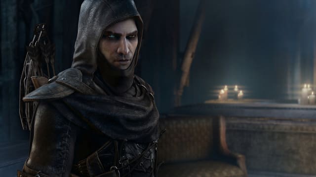 Der Protagonist Garrett in dunkler Kapuze und mit je einem blauen und einem braunen Auge. Der Protagonist Garrett in dunkler Kapuze und mit je einem blauen und einem braunen Auge.