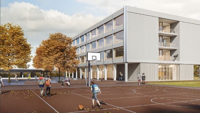 Kubisches Gebäude mit Glasfront, im Vordergrund Sportplatz Kubisches Gebäude mit Glasfront, im Vordergrund Sportplatz