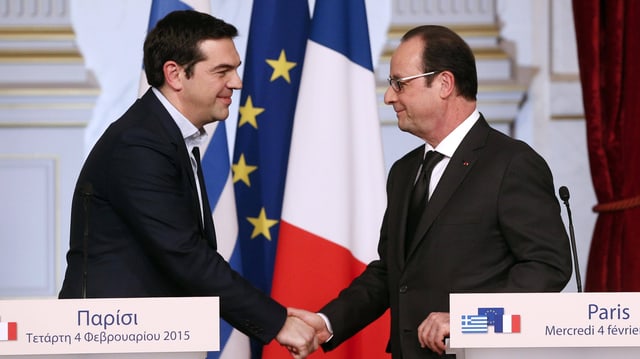 Hollande und Tsipras schütteln sich die Hände. Hollande und Tsipras schütteln sich die Hände.