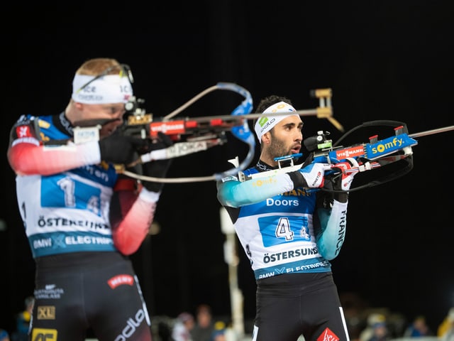 Martin Fourcade (r.) und Johannes Thingnes Bö am Schiesstand. Martin Fourcade (r.) und Johannes Thingnes Bö am Schiesstand.