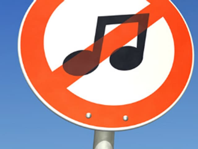 Ein Verbotschild mit einer Musiknote Ein Verbotschild mit einer Musiknote