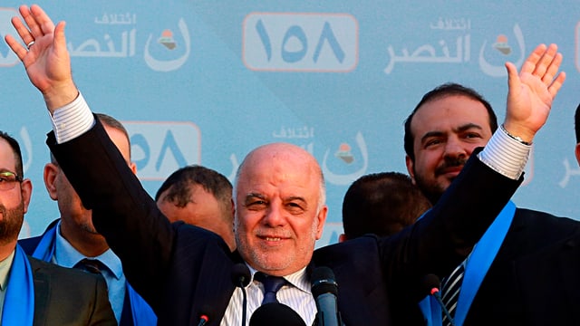 Haidar al-Abadi strecktz beide Hände in die Luft Haidar al-Abadi strecktz beide Hände in die Luft