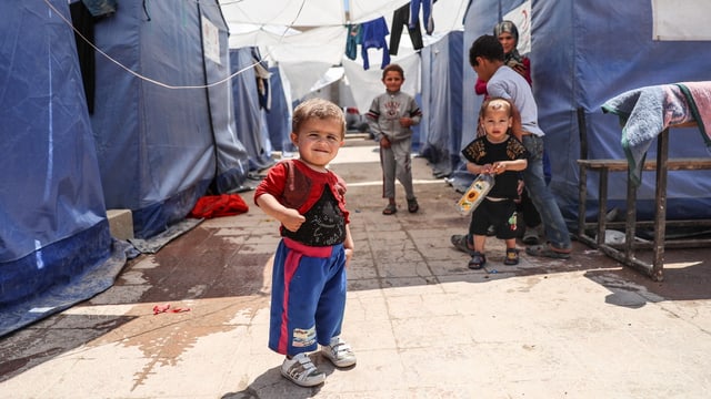 Kinder in einem Flüchtlingscamp. Kinder in einem Flüchtlingscamp.