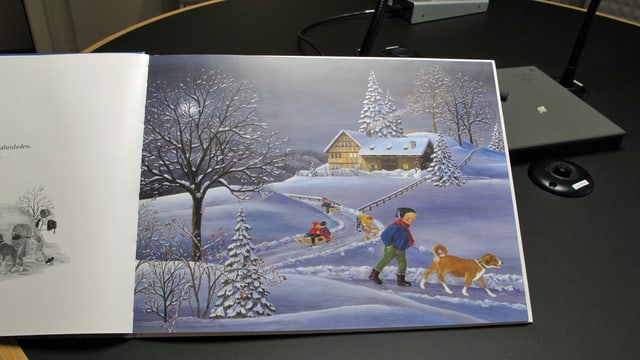 Seite aus dem Bilderbuch mit einer Winterlandschaft Seite aus dem Bilderbuch mit einer Winterlandschaft