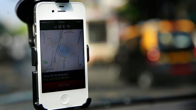Uber-App auf dem Smartphone. Uber-App auf dem Smartphone.